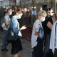 Commuters wearing protective face masks board a train on August 07, 2020 in Berlin, Germany.